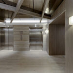 Intricate millwork and updated lighting installed on the penthouse floor by Capital Contractor Services