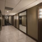 Elevator lobby at Flamenco Towers featuring a large mirror