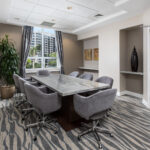Renovated conference room with new flooring, lighting and paint in Miami, FL by Capital Contractor Services