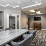 Renovated conference room with new flooring, lighting and paint in Miami, FL by Capital Contractor Services