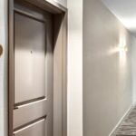 Details of resident door with a view of tags, lighting and new carped installed by Capital