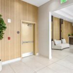 Elevator lobby exit door and walls renovated by Capital Contractor Services