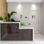 Detailed view of porcelain front desk installed by Capital