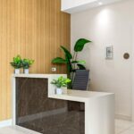 Side view of waterfall porcelain front desk installed by Capital