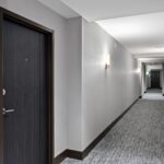 Penthouse resident corridor with new flooring, lighting and wall coverings by Capital Contractor Services