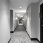 Penthouse resident corridor with new flooring, lighting and wall coverings by Capital Contractor Services
