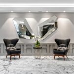 Seating area featuring new marble floors and lighting at Costa Brava renovated by Capital Contractor Services