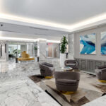 View of the main lobby from the garage entry door, featuring new marble floors, new paint and lighting and modern furniture