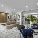 Modern furniture, new marble flooring and millwork walls installed by Capital Contractor Services at Costa Brava
