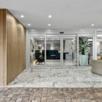 Main entrance featuring a marble column and flooring