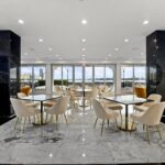 The party room received a full renovation, including the flooring, lighting, marble columns, kitchen appliances, finishes and furniture.