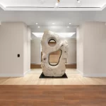 View of concierge area with renovated flooring, lighting, and art installations at the Roney Palace